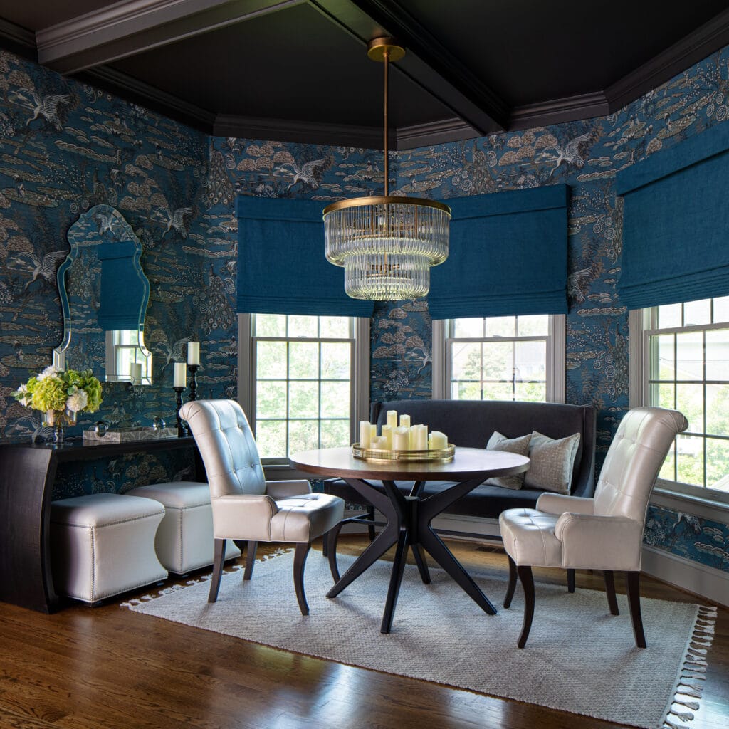 a dining area with bold blue and white colors by an interior design professional